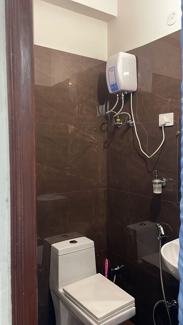 Bathroom in 2 BHK Apartment at Soho Apartments, Shakti Khand – for Rent