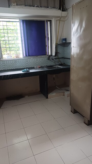 Kitchen in 2 BHK Apartment at Riddhi Enclave Co-op Housing Society Ltd, Viman Nagar – for Rent