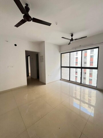 Living Room in 2 BHK Apartment at Lodha Palava River Front, Dombivli East – for Sale