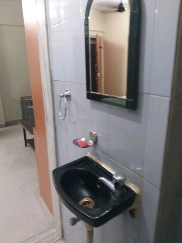 Bathroom in 1 BHK Apartment at Sai Alpa CHS, Malad West – for Rent
