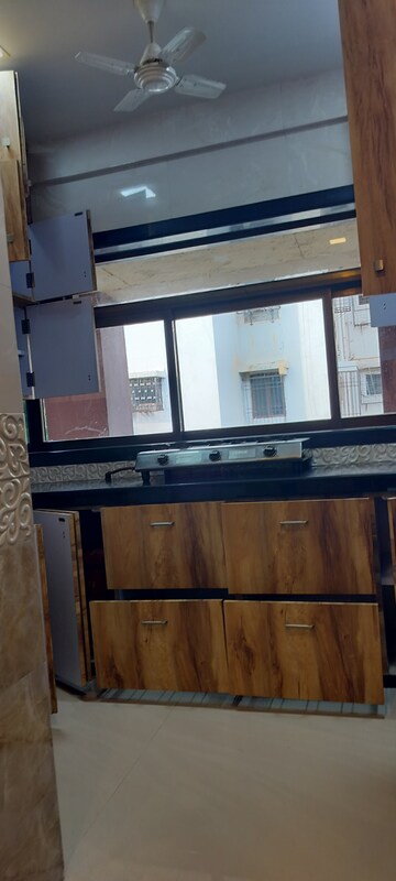 Kitchen in 1 BHK Apartment at Mudheshwari CHS, Khar West – for Rent