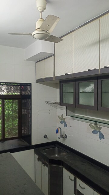 Kitchen in 1 BHK Apartment at Panchavati Gardens, Malad East – for Rent