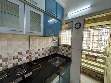 Kitchen in 2 BHK Apartment at Cosmos Orchid, Kasarvadavali – for Rent