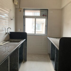 Kitchen in 1 BHK Apartment at Glasswood Om Sarjan CHSL, Dalvi Nagar – for Sale