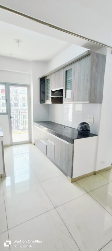 Kitchen in 1.5 BHK Apartment at Mahagun Mywoods, Sector 16c Greater Noida – for Rent