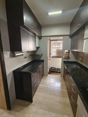 Kitchen in 3 BHK Apartment at DB Realty Shagun Towers, Goregaon East – for Rent