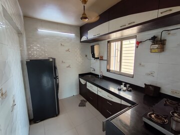 Kitchen in 2 BHK Apartment at Mahalaxmi Tower Kasarvadavali, Kasarvadavali – for Rent