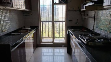 Kitchen in 2.5 BHK Apartment at Rosa Gardenia, Ghodbunder Road – for Rent