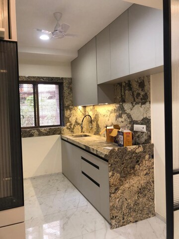 Kitchen in 3 BHK Apartment at Riddhi Garden, Malad East – for Rent