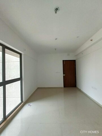 Living Room in 1 BHK Apartment at Lodha Palava Downtown Dombivli East, Dombivli East – for Sale
