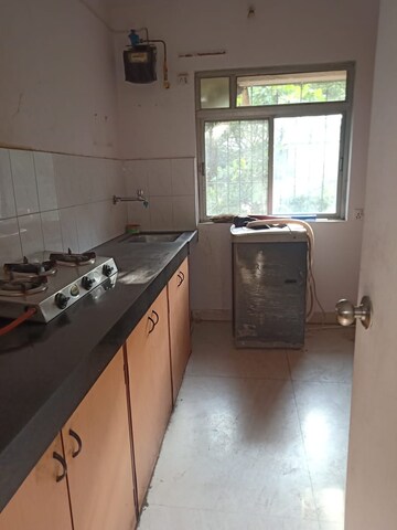 Kitchen in 2 BHK Apartment at Happy Valley, Manpada – for Rent