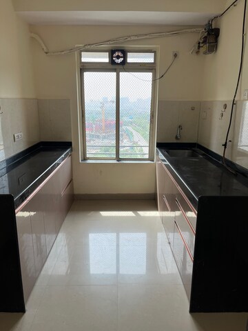 Kitchen in 2 BHK Apartment at Rustomjee Urbania Astraea, Majiwada – for Rent