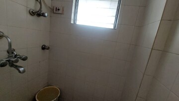 Bathroom in 1 BHK Apartment at Dheeraj Valley, Goregaon East – for Rent