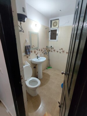 Bathroom in 2 BHK Apartment at Aims Golf City, Sector 75 – for Sale