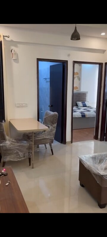 Living Room in 1.5 BHK Apartment at Prateek Grand Carnesia, Siddharth Vihar – for Rent