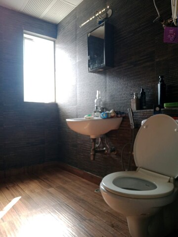 Bathroom in 2.5 BHK Apartment at Aims Golf City, Sector 75 – for Sale