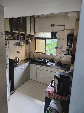 Kitchen in 3 BHK Apartment at Om Shree Green Park, Virar West – for Sale