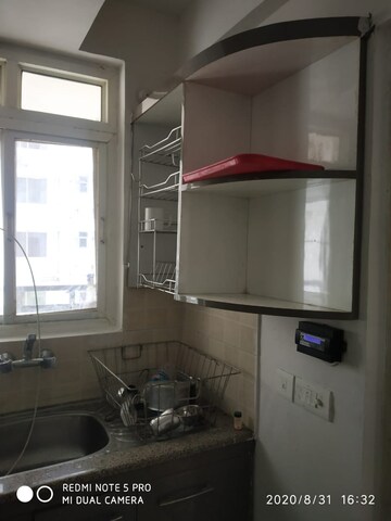Kitchen in 2 BHK Apartment at Supertech Czar Suites, Omicron I Greater Noida – for Sale