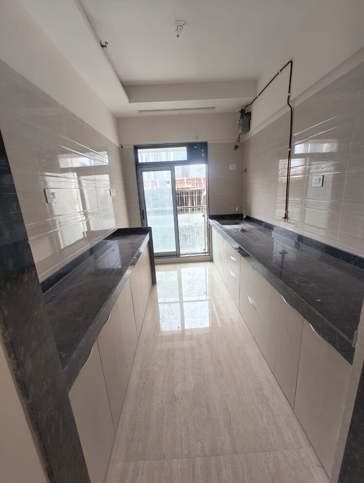 Kitchen, je-and-vee-om-trimurti 3 Bedroom 941 Sq.Ft. Apartment In Malad East Mumbai 8806391