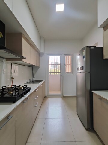 Kitchen in 3 BHK Apartment at Bhartiya Nikoo Homes Phase 2, Thanisandra Main Road – for Rent