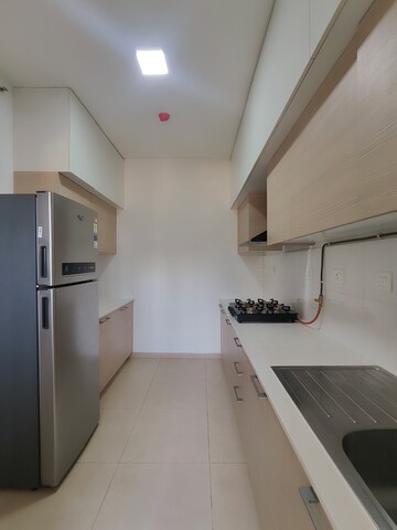 Kitchen in 3 BHK Apartment at Bhartiya Nikoo Homes Phase 2, Thanisandra Main Road – for Rent