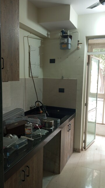 Kitchen in 1 BHK Apartment at Hiranandani Estate Flora, Ghodbunder Road – for Sale