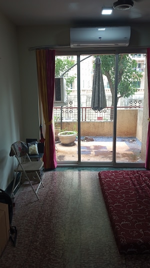 Living Room in 1 BHK Apartment at Hiranandani Estate Flora, Ghodbunder Road – for Sale