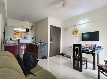 Living Room in 1 BHK Apartment at Mantra Insignia, Mundhwa – for Rent