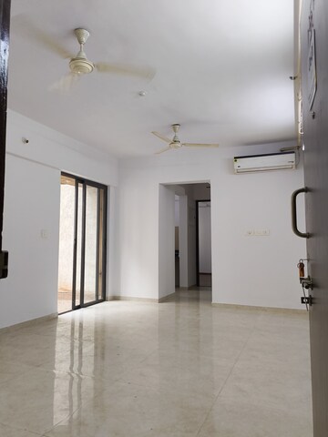 Living Room in 1 BHK Apartment at Lodha Palava Downtown, Dombivli East – for Rent