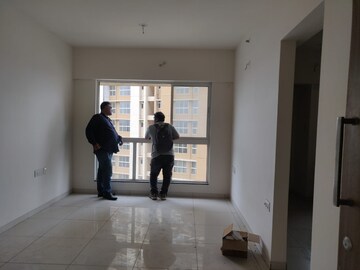 Living Room in 1 BHK Apartment at Godrej Nirvaan, Themghar – for Rent