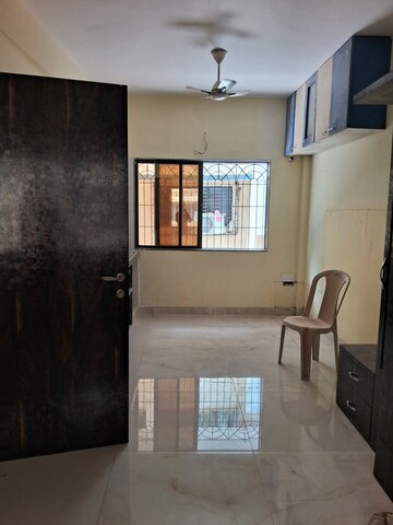 Living Room in 1 RK Apartment at Zamuna CHS, Kopar Khairane – for Rent