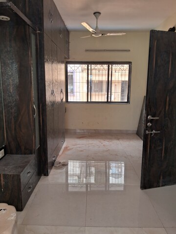 Living Room in 1 RK Apartment at Zamuna CHS, Kopar Khairane – for Rent
