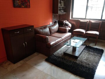 Living Room in 2 BHK Apartment at Juhu Taj CHS, Vile Parle West – for Rent