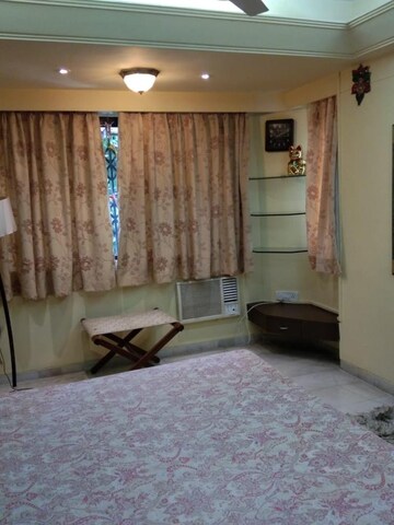 Living Room in 2 BHK Apartment at Juhu Taj CHS, Vile Parle West – for Rent