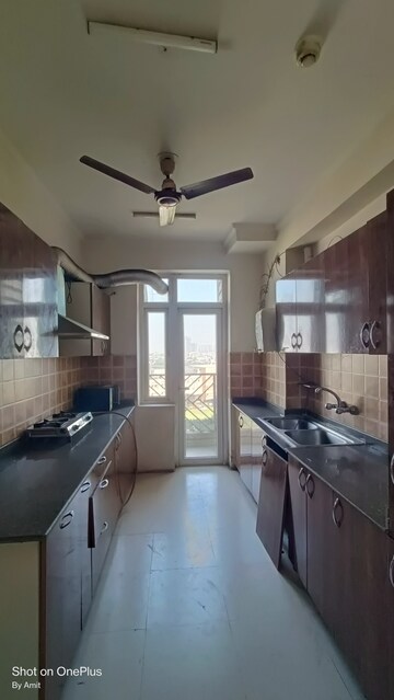 Kitchen in 3 BHK Apartment at Amrapali Eden Park, Sector 50 – for Sale