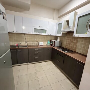 Kitchen in 3 BHK Apartment at Mahagun Moderne, Sector 78 – for Rent
