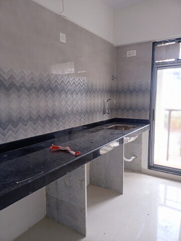 Kitchen in 5 BHK Apartment at Bhimjyani Verraton, Manpada – for Sale