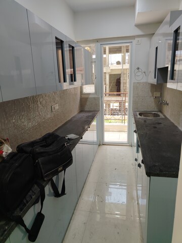 Kitchen in 2 BHK Apartment at Signature The Millennia 2, Sector 37d – for Rent