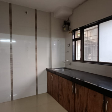 Kitchen in 2 BHK Apartment at Dedhia Platinum, Waghbil – for Rent
