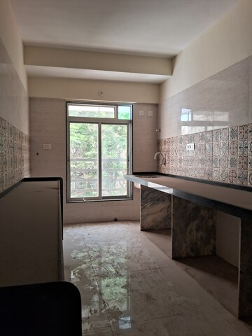 Kitchen in 1.5 BHK Apartment at Ayyappa Prerana Apartment, Goregaon West – for Sale