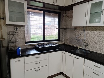 Kitchen in 2 BHK Apartment at Royal Palms Garden View, Goregaon East – for Rent