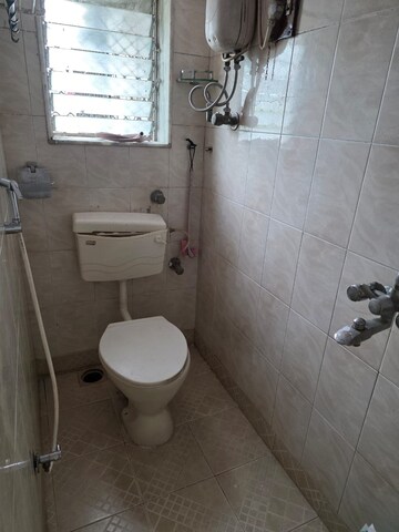 Bathroom in 2 BHK Apartment at Margadarshan CHS, Andheri East – for Rent