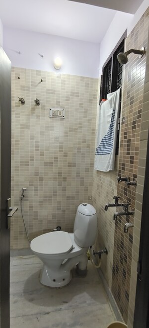 Bathroom in 3 BHK Builder Floor at Dwarka Mor – for Sale