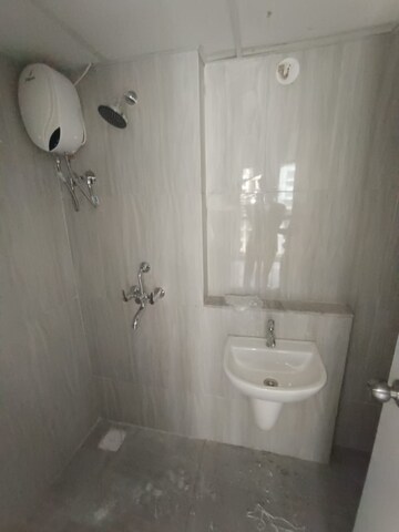 Bathroom in 1 BHK Apartment at Runwal Gardens, Dombivli East – for Rent