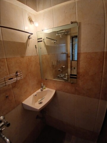 Bathroom in 1 BHK Apartment at Glasswood And Lucky Vishwa Villa, Malad West – for Rent