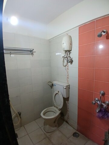 Bathroom in 2 BHK Apartment at Nav Jyotirling CHS, Malad East – for Rent