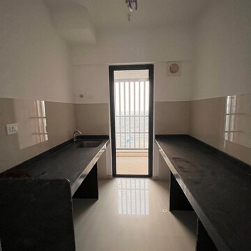 Kitchen in 1 BHK Apartment at Lodha Palava Downtown, Taloja Bypass Road – for Sale