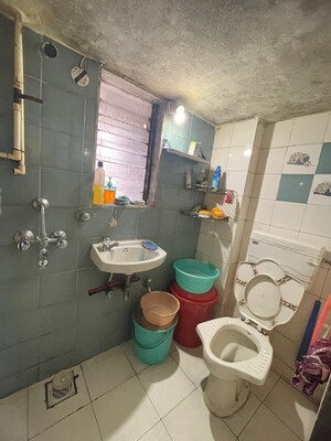 Master Bedroom in 1 BHK Apartment at Divya Smith Chs, Kandivali West – for Sale