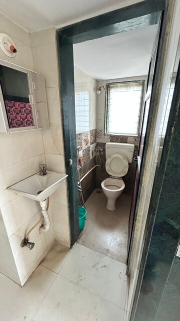 Bathroom in 1 BHK Apartment at Rajiv Thakur Jai Santoshi Mata Heights, Dombivli East – for Sale