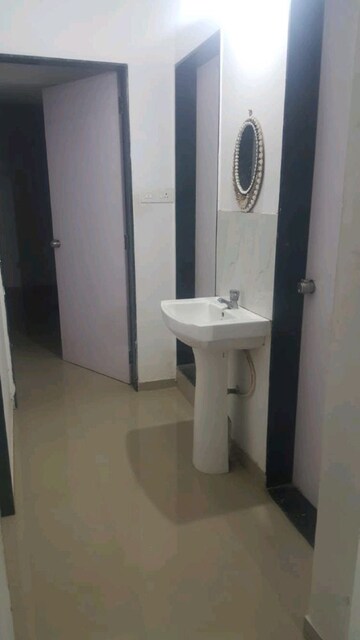 Bathroom in 2 BHK Apartment at Raj Heramba Venkatesh Imperia, Tathawade – for Rent